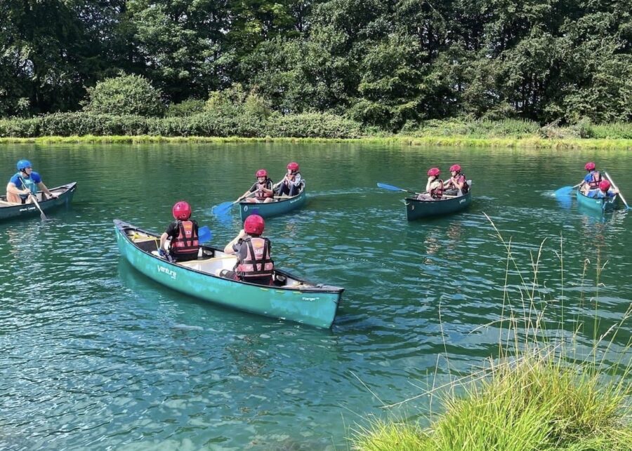 Kids In Canoes